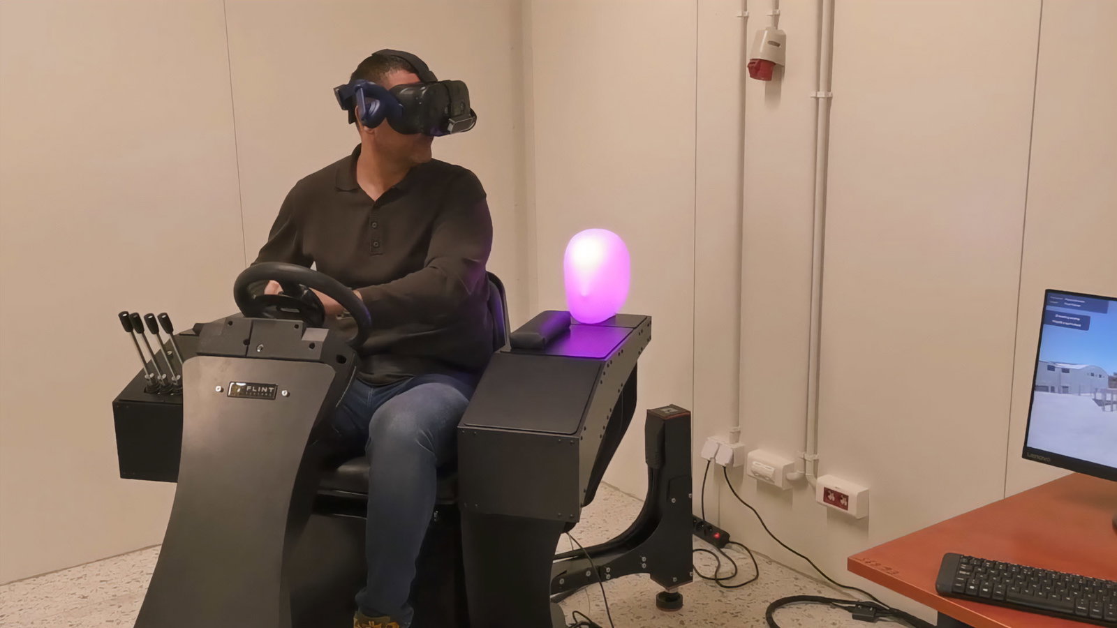 VR forklift motion simulator cockpit with steering wheel and controls